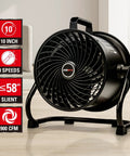 Black 10 Inch Drum Fan With 900 CFM, 3 Speed Industrial Floor Fan, Tilt Head 360 Degree, displayed on wooden floor.