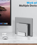 Dual Dock Vertical Laptop Stand With Aluminum Desktop Frame holding two laptops in office setup
