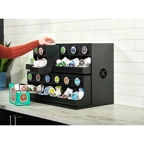 12 Count Modular Merchandiser For Coffee Stations With Slim Space Saving Design shown with K-Cup pods on countertop.