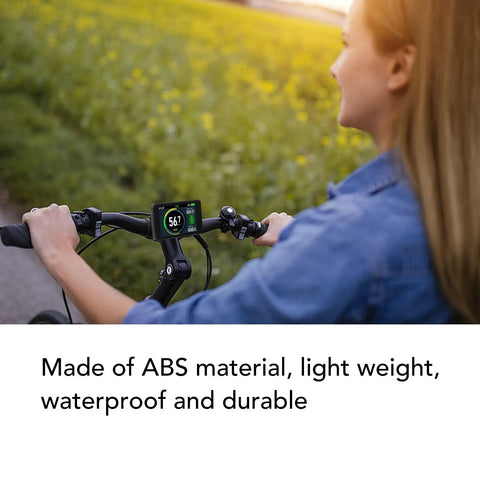 Woman riding bike with Universal Electric Bike LCD Display With Waterproof 5 Pin Connector, Handles 24V To 72V Systems, ABS Speedometer
