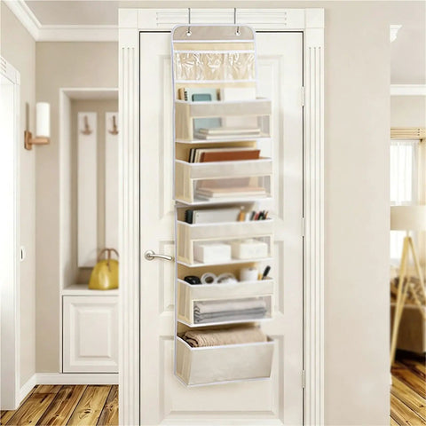 Heavy Duty Over The Door Organizer And Hanging Closet Storage Rack With Multiple Pockets keeps your bathroom tidy with beige pouches.