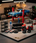 Top Shelf Miniature Vehicle Repair Shop Scene Featuring Resin Seats And Tire Balancing Machine For Collectible Scale Dioramas And Knockout Model Garage Displays in detailed workshop layout.