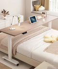 Cool Electric Lift Over Bed Table With Wheels Lets You Work From Home Or Hospital Using Solid Wood Top And Steel Frame for quiet height adjustments.