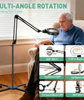 Go To Floor Standing Magnifier With Light And Stand, 12X Large Illuminated Magnifier with elderly man reading in chair
