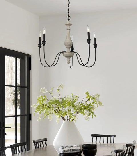 Magnolia Five Light Chandelier in white washed wood and matte black metal with exposed bulbs over dining table, modern rustic vibe
