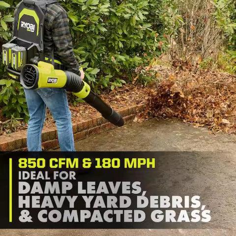 Badass 40V Cordless Backpack Leaf Blower With Brushless Motor clearing damp leaves and yard debris in a garden.