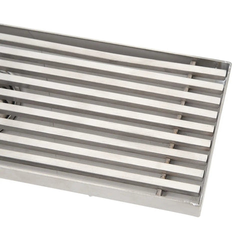 Close-up of Oreilet Linear Shower Drain Bathroom Floor Drain with Hair Catcher (Side) featuring stainless steel slats.