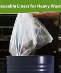 Person using Beefy 11 Mil Dust Collector Replacement Bags 19.5 Inch Diameter Fits 35 And 70 Gallon Systems, 31 Inches Wide By 40 Inches Long