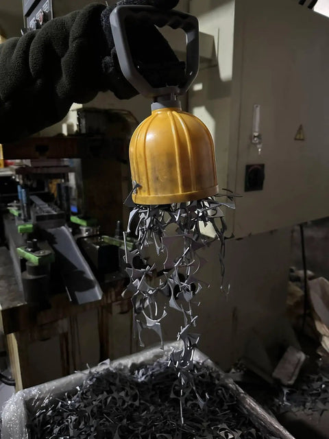 Powerful Magnetic Pickup Tool With Quick Release Lifter lifting metal scraps in workshop