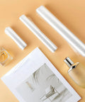 Premium Heat Shrink Bags With Self Adhesive Edge And Crystal Clear Film For Effortless Diy Crafting Gift Wrapping Includes 4x6 7x10 Plus 10x14 Packs displaying rolls and packaged items.