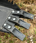 Close-up of replaceable teeth on Mega Wrecker stump bucket for tractors and skid steers up to 105 HP with bi-directional ripping edge.