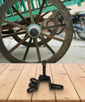 Heavy Duty High Carbon Steel Bearing Remover Tool and Brake Drum Puller shown on wooden surface near vintage wheel