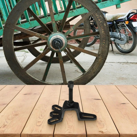 Heavy Duty High Carbon Steel Bearing Remover Tool and Brake Drum Puller shown on wooden surface near vintage wheel