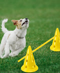 Dog playing with Dog Agility Hurdle Cone Set For Backyard Training Height Adjustable Obstacle Course Kit in yellow