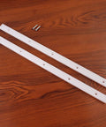 Two white UHMW miter bars, 17 in long, 3/4 in tall by 3/8 in wide, with predrilled holes and screws