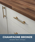 Champagne Bronze Cabinet Pulls 10-Pack, 5-1/16 Inch Hole Center shown on white cabinets with wooden countertop.