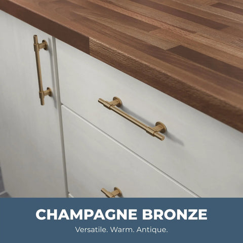 Champagne Bronze Cabinet Pulls 10-Pack, 5-1/16 Inch Hole Center shown on white cabinets with wooden countertop.