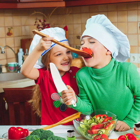 Wooden kids kitchen knife set with blue accents; children wearing chef hats cooking in a kitchen.