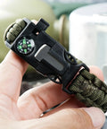 Close-up of 5 In 1 Paracord Survival Bracelet With Compass Fire Starter Whistle Glass Breaker And Paracord For Camping Hiking