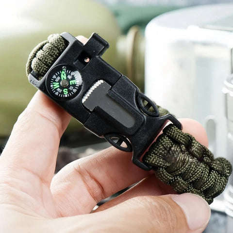 Close-up of 5 In 1 Paracord Survival Bracelet With Compass Fire Starter Whistle Glass Breaker And Paracord For Camping Hiking