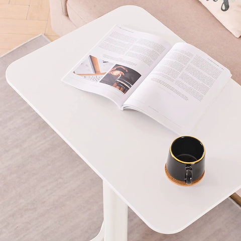 Slick Mobile Lectern Podium Stand With Smooth Roll Sit Stand Laptop Desk And Roomy Notebook Cart Build For Home Office Flex Workstations In Clean White Finish, featuring an open design with a book and mug.