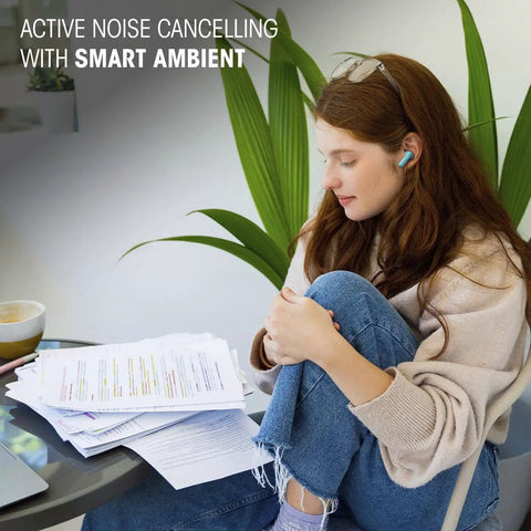 Woman wearing Vibe Beam 2 True Wireless Earbuds With Active Noise Cancelling And Smart Ambient in a relaxed setting