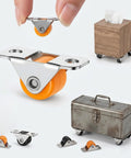8 Pack Rock Solid Slick Low Profile Fixed Caster Wheels With Heavy Duty Metal Mounting Plate 1/2 Inch Non Swivel Castors For Furniture Storage Bins Home Diy And Cabinet Sliding displayed with orange wheels and mini models.