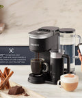 Smart WiFi Single Serve Coffee Maker For Home Baristas That Delivers Coffee Lattes And Cappuccinos With Built In Frother BrewID Pod Recognition And Six Brew Sizes Black on a kitchen counter