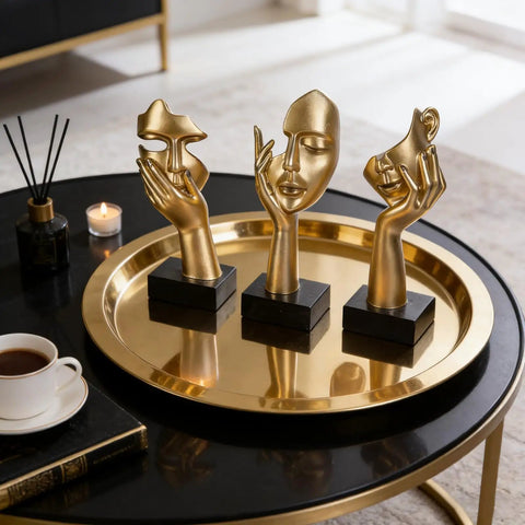 Three Piece Thinker Statue Set Black Gold Modern Home Decor Abstract Figurines on round gold tray on coffee table