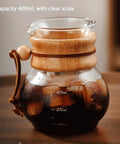 Top Shelf Cold Brew Drip Tower and Ice Drip Coffee Machine With Slow Drip Tech and Adjustable Water Flow Control and 400ML Glass Carafe filled with ice coffee