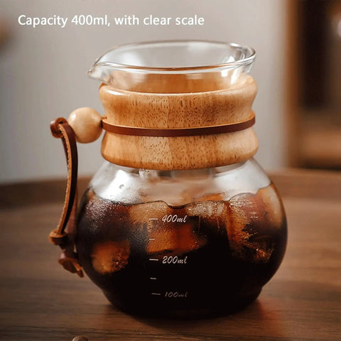 Top Shelf Cold Brew Drip Tower and Ice Drip Coffee Machine With Slow Drip Tech and Adjustable Water Flow Control and 400ML Glass Carafe filled with ice coffee