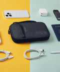 Cord Organizer Travel Kit For Chargers And Cables, Slim Single Layer Tech Bag with accessories on table, black.