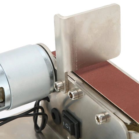 Close-up of Fafeicy 200W Mini Belt Sander's brass motor, adjustable speed dial, and sanding belt for polishing and grinding.