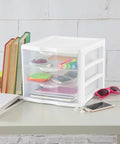 4 Pack 3 Drawer Stackable Plastic Organizer With Drawers White Frame on desk holding office supplies and books