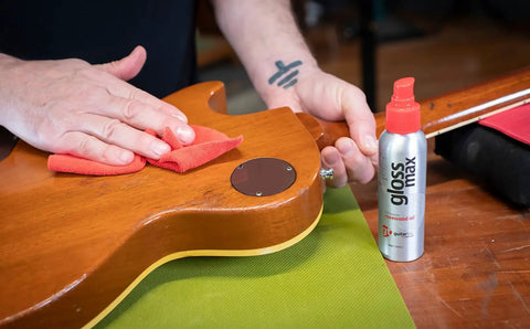 Premium Guitar Polish That Brings Your Axe Back To Life With A Blazing Clean Glossy Finish Includes Soft Microfiber Cloth application on guitar.
