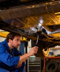Mechanic using Telescoping Inspection Mirror Set With 360 Degree Swivel Extendable To 30.5 Inches under a car for repair inspection.