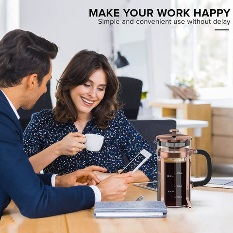 Stainless Steel French Press Coffee Maker With Borosilicate Glass Carafe Copper Finish 21 Ounce Capacity Four Level Filter on office table