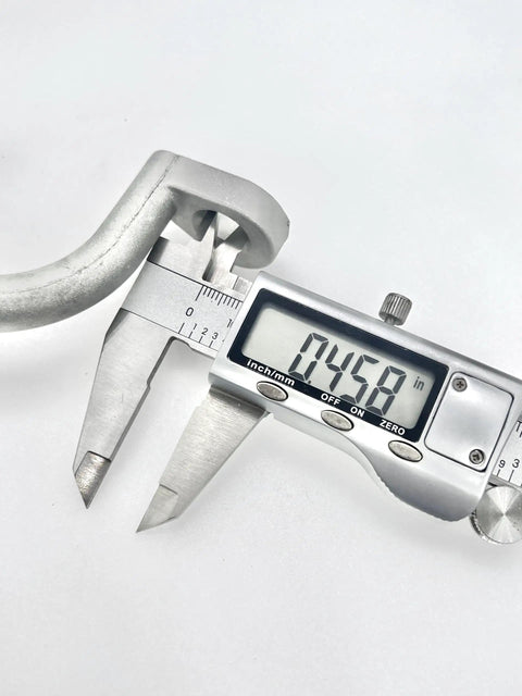 Close-up measuring caliper with Aluminum Bolt On Trailer Tie Loop Ring Set, 2 Inch Inner Diameter, Heavy Duty Lashing Tie Down Ring