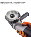 Heavy Duty Carbon Steel Wood Carving Wheel And Wood Shaping Disc For Angle Grinder held in a gloved hand, showcasing sturdy design.