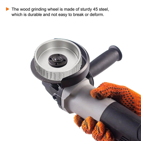 Heavy Duty Carbon Steel Wood Carving Wheel And Wood Shaping Disc For Angle Grinder held in a gloved hand, showcasing sturdy design.