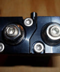 Smc Cdrqb 20 rotary actuator, air cylinder; black metal housing with dual circular ports (top view)