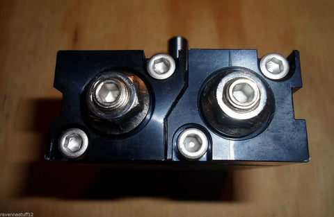 Smc Cdrqb 20 rotary actuator, air cylinder; black metal housing with dual circular ports (top view)