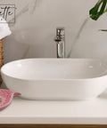 Bathroom countertop with Pink Ceramic Soap Dispenser With Gold Pump For Bathroom Or Kitchen Sink, Cute Bird Design Hand And Dish Soap Holder, Durable Glazed Finish, Modern Countertop Decor For Home.