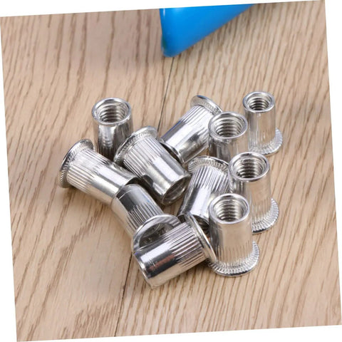 Rock Solid 86 Piece Rivet Nut Kit And Heavy Duty Tool For Metal Assembly Jobs Perfect For Steel Projects Electrical Wiring Ducts And General Fabrication Tasks With M5 M7 M8 Sizes Included In This Ultimate Rivnut Gun Set. M5 aluminum rivet nuts on wood surface