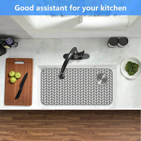 Top view of Pro Grade Silicone Sink Mat Grid for Kitchen Sink Protection in stainless steel sink with wooden countertop.