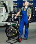 Heavy Duty Strapping Cart And Dispenser For Polypropylene Coils With Integrated Tool And Seal Tray Fits 8x8 To 10x10 Inches in a warehouse.