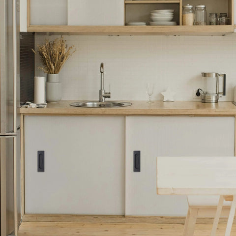 Modern kitchen featuring 4.72 Inch Matte Black Recessed Finger Flush Cabinet Pulls By Malimali installed on sliding cupboard doors.