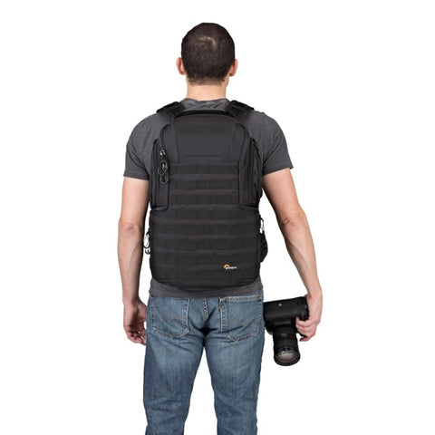 Person wearing ProTactic BP 450 AW 2 25L Modular Camera Backpack With CradleFit Pocket All Weather Cover SlipLock Compatible Accessories.