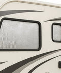 16 By 10 Foot Bubble Double Reflective Insulation Roll With Foam Core Thermal Shield For Rv Windows And Interior Doors Featuring Self Adhesive Pads applied on RV windows.