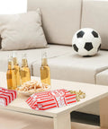 Heavy Duty Paper Popcorn Bags 1 Oz Individual Servings 500 Pack For Popcorn Machines Small Mini Bags For Carnival Parties And Home Snacking on table with snacks and drinks